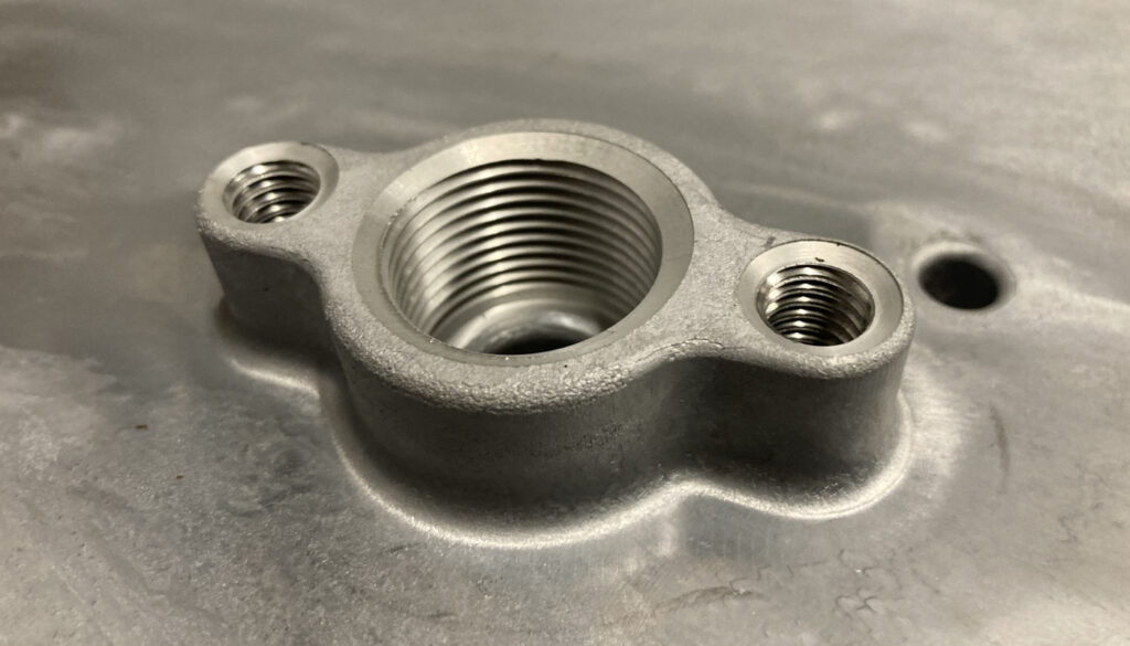 Three tapped holes in aluminum die cast part
